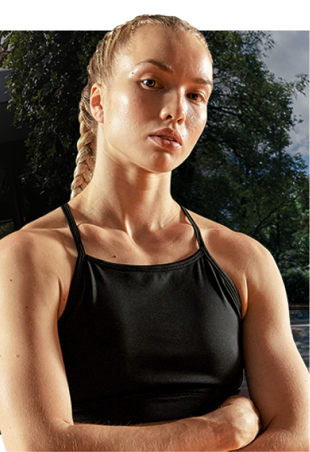 A young woman standing with her arms crossed