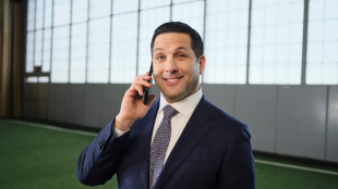 Adam Schefter on the phone smiling