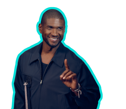 Usher smiling and holding up his index finger