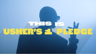A silhouette of Usher wearing sunglasses and holding his right hand up